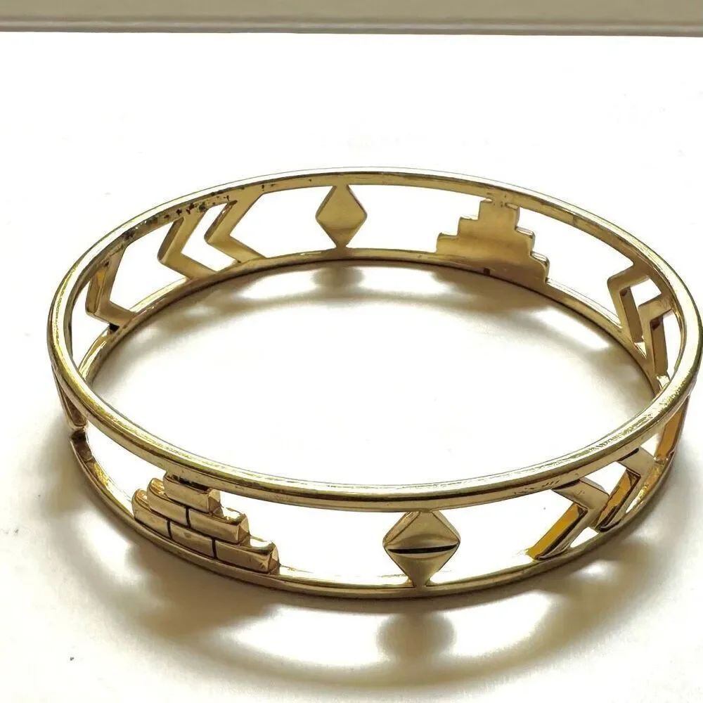 Gold tone cut out bangle bracelet